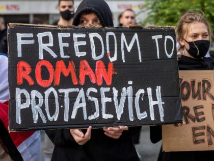 Belarusians living in Poland and Poles supporting them hold up a placard reading 'Freedom to Roman Protasevich' during a demonstration in front of the European Commission office in Warsaw on May 24, 2021, demanding freedom for Belarus opposition activist Roman Protasevich a day after a Ryanair flight from Athens to …