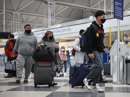 ravelers arrive for flights at O'Hare international Airport on March 16, 2021 in Chicago,