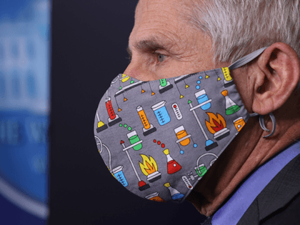 National Institute of Allergy and Infectious Diseases Director Dr. Anthony Fauci wears a l