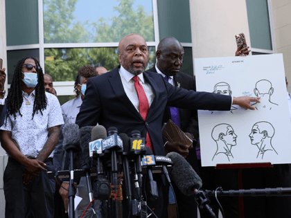 Wayne Kendall, one of the lawyers representing the family of Andrew Brown Jr., points to an autopsy chart that his team conducted showing where Mr. Brown was shot on April 27, 2021 in Elizabeth City, North Carolina. Mr. Kendall and family members spoke to the media about the 20 seconds …