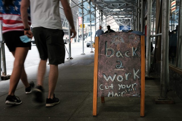 NEW YORK, NEW YORK - MAY 04: People walk through Manhattan on May 04, 2021 in New York Cit
