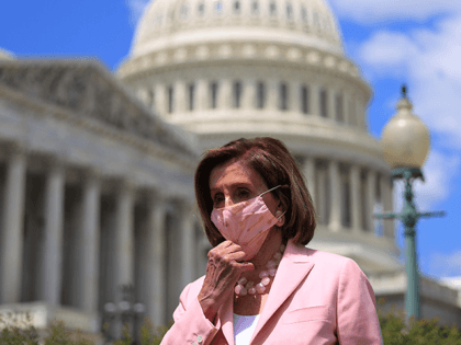 Speaker of the House Nancy Pelosi (D-CA) adjusts her face mask during a news conference on infrastructure outside the U.S. Capitol on May 12, 2021 in Washington, DC. Pelosi met with President Joe Biden and her Republican counterparts earlier in the day to discuss Biden's infrastructure plan. (Photo by Chip …