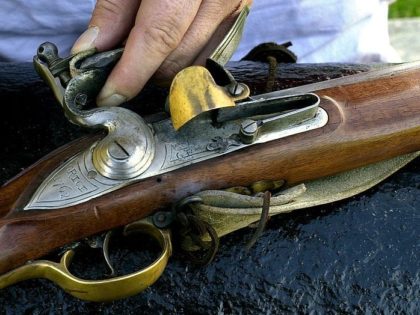 PHILADELPHIA - NOVEMBER 9: A colonial reenactor repairs his musket before the reenactment of the siege of Fort Mifflin November 9, 2002 in Philadelphia, Pennsylvania. The event was held to celebrate the 225th anniversary of the Revolutionary War battle. The British army fought the Colonials for control of the fort …