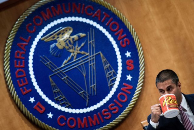 FCC Chairman Ajit Pai listens during a hearing at the Federal Communications Commission on December 14, 2017 in Washington, DC. / AFP PHOTO / Brendan Smialowski (Photo credit should read BRENDAN SMIALOWSKI/AFP via Getty Images)