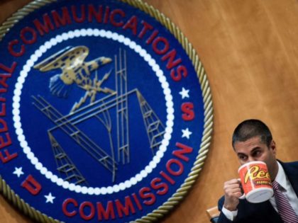 FCC Chairman Ajit Pai listens during a hearing at the Federal Communications Commission on