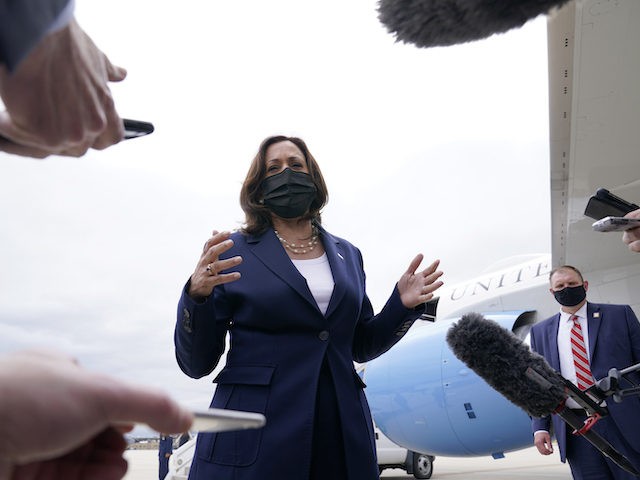 Vice President Kamala Harris talks to reporters before boarding Air Force Two as she departs Milwaukee Mitchell International Airport in Milwaukee, Tuesday, May 4, 2021. Harris was in Milwaukee for a visit to promote President Joe Biden’s $2 trillion jobs and infrastructure plan. (AP Photo/Susan Walsh)