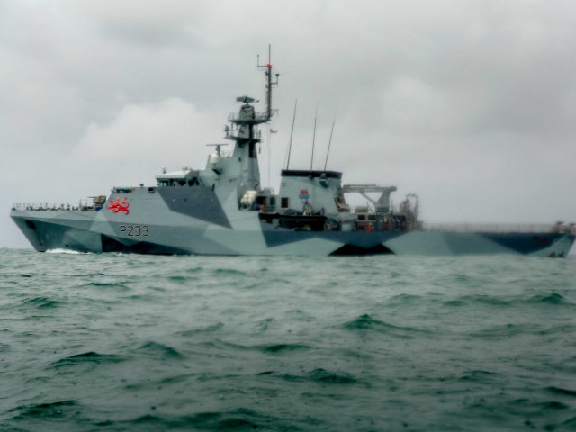 ST HELIER, JERSEY - MAY 06: HMS Tamar is deployed as French fishing boats sail into harbou