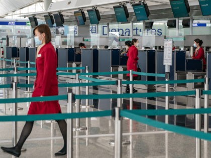 Cathay Pacific ground support workers at check in counter at the Hong Kong International Airport on October 21, 2020 in Hong Kong, China. Hong Kong airline Cathay Pacific Airways announced to cut 8,500 jobs and shut down its regional airline unit Cathay Dragon in a corporate restructuring, as it grapples …