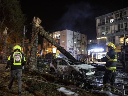An Israeli firefighter works at the site where a rocket fired from the Gaza Strip, hit the central Israeli town of Holon, near Tel Aviv, Tuesday, May 11, 2021. A confrontation between Israel and Hamas sparked by weeks of tensions in contested Jerusalem escalated Tuesday as Israel unleashed new airstrikes …