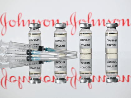 An illustration picture shows vials with Covid-19 Vaccine stickers attached and syringes with the logo of US pharmaceutical company Johnson & Johnson on November 17, 2020. (Photo by JUSTIN TALLIS / AFP) (Photo by JUSTIN TALLIS/AFP via Getty Images)