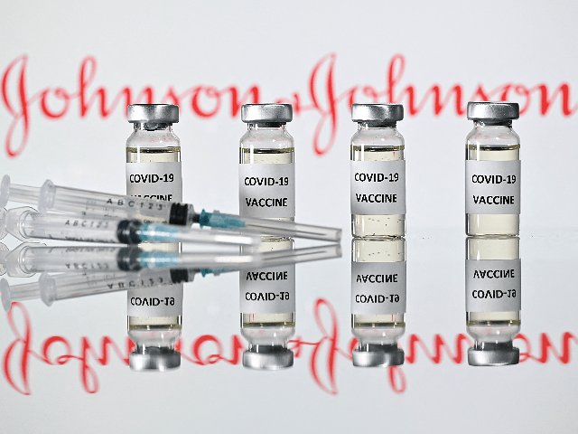 An illustration picture shows vials with Covid-19 Vaccine stickers attached and syringes w