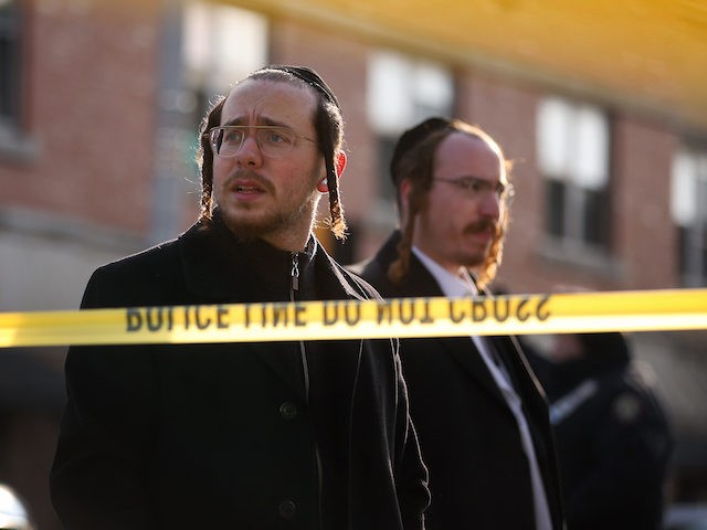 JERSEY CITY, NJ - DECEMBER 11: A large contingent of Orthodox Jews gather around the JC Ko