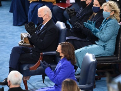 WASHINGTON, DC - JANUARY 20: (L-R) US President-elect Joe Biden, US Vice President-elect Kamala Harris and incoming US First Lady Jill Biden applaud at the beginning of the for the swearing in ceremony during the 59th Presidential Inauguration at the U.S. Capitol on January 20, 2021 in Washington, DC. During …