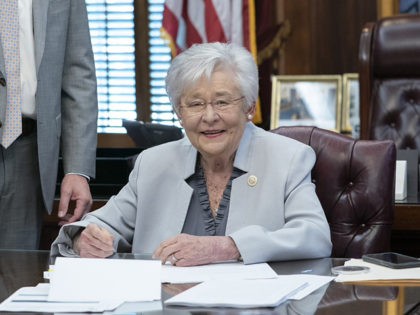 Kay Ivey signs voter bill