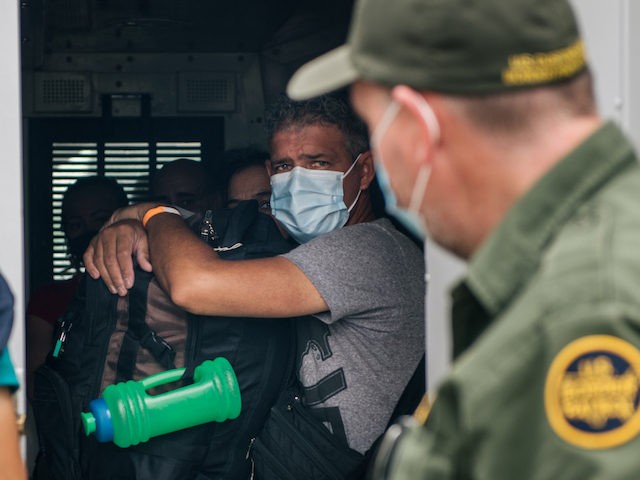 DEL RIO, TEXAS - MAY 17: Immigrants prepare to be taken to a border patrol processing faci