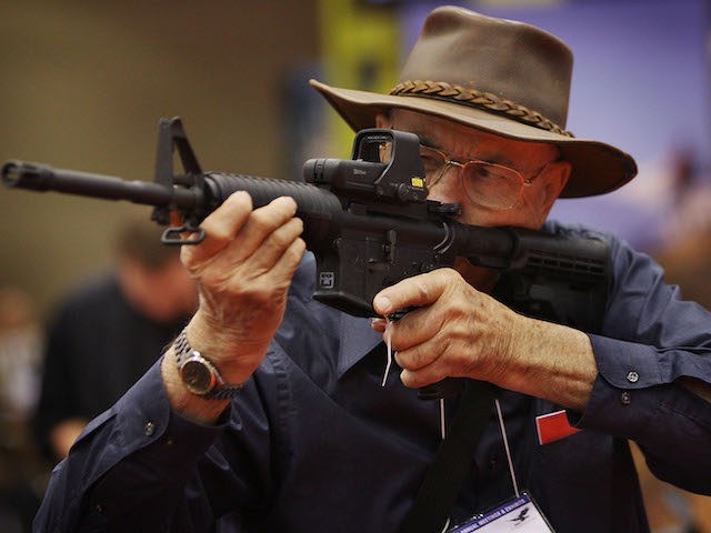 WWII veteran Ray Cahow, 82, checks out an ArmaLite rifle at the National Rifle Association of America's (NRA) annual meeting at the Kentucky Exposition Center May 16, 2008 in Louisville, Kentucky. The annual meeting and exhibits for the NRA, which boasts about 4 million members, will run through May 18. …