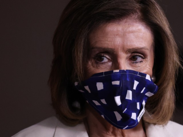 Speaker of the House Nancy Pelosi (D-CA) wears a cloth mask to cover her mouth and nose to prevent the spread of the novel coronavirus during her weekly news conference at the U.S. Capitol April 30, 2020 in Washington, DC. While she and Democratic House leaders are not going to reconvene next week due to the COVID-19 pandemic, she said committee chairs are working on the next piece of economic rescue legislation. (Photo by Chip Somodevilla/Getty Images)