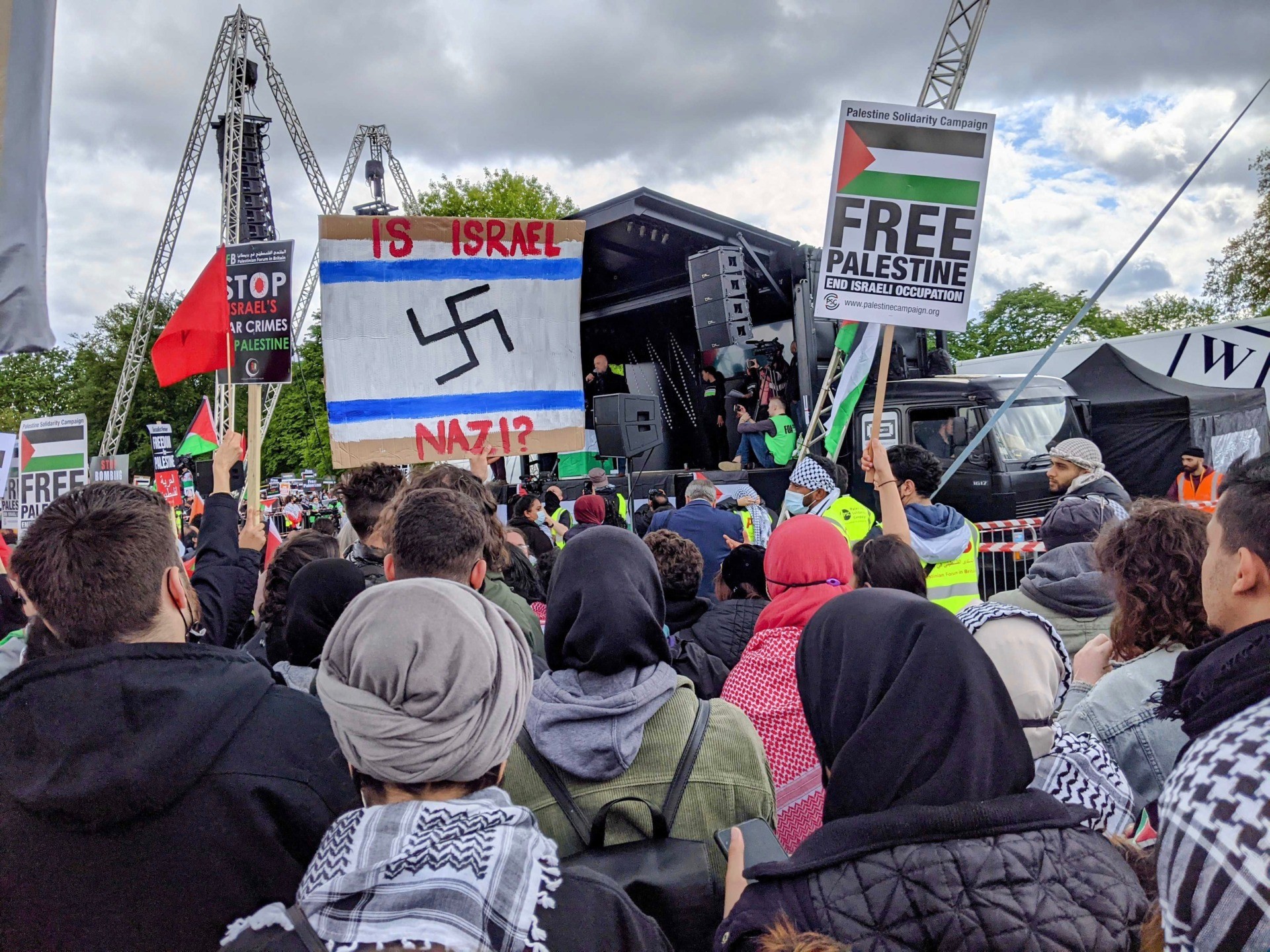 An anti-Semitic placard comparing the Jewish state of Israel to Nazi Germany is seen at an anti-Israel protest on Saturday May 22nd, 2021. Kurt Zindulka, Breitbart News