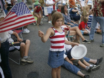 Parade goers watch floats as he Independence Day parade makes its way through Wimberley, Texas on July 4, 2008. (Ben Sklar/Getty Images)