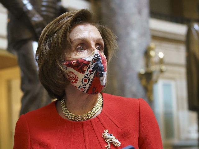 House Speaker Nancy Pelosi, D-Calif., walks to her office after meeting with the family of