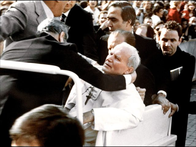 Bodyguards hold Pope John Paul II (C) after he was shot 13 May 1981 on Saint Peter's squar