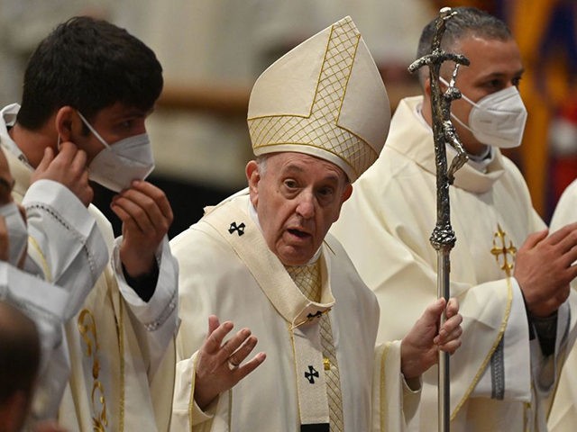 Pope Francis talks to nine newly-ordained priests as they pose for a group photo, asking them them to take off their face mask, at the end of an ordination mass on April 25, 2021 at St. Peter's Basilica in The Vatican, during which Pope Francis ordained nine new priests for …