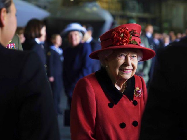 Britain's Queen Elizabeth II smiles during a visit to HMS Queen Elizabeth at HM Naval Base