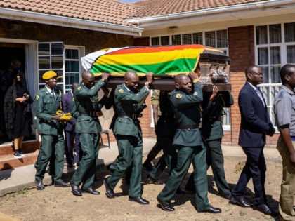 Pallbearers carry the coffin of late former Zimbabwe President Robert Mugabe for a mass at the family homestead in Kutama village, 80km northwest of Harare, on September 17, 2019. - The remains of former Zimbabwe president Robert Mugabe, who died on September 6, arrived in his home village on September …