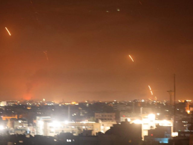 Rockets are launched towards Israel from Rafah, in the southern Gaza Strip, early on May 12, 2021. - Palestinian militants Hamas said on May 12 that they had fired more than 200 rockets into Israel, in retaliation for strikes on a tower block in the Israeli-blockaded enclave of Gaza, which …