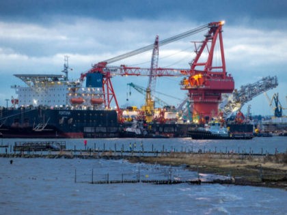 In this Jan. 14, 2021 file photo, Tugboats get into position on the Russian pipe-laying vessel "Fortuna" in the port of Wismar, Germany, Thursday, Jan 14, 2021. The special vessel is being used for construction work on the German-Russian Nord Stream 2 gas pipeline in the Baltic Sea. The company …
