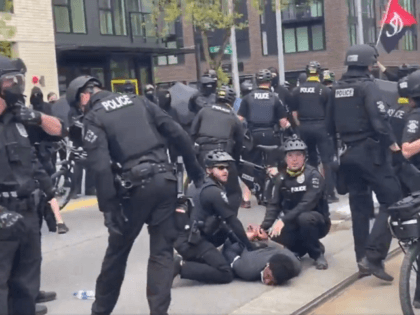 Seattle police make an arrest during an Antifa May Day riot. (Twitter Video Screenshot/Katie Daviscourt)