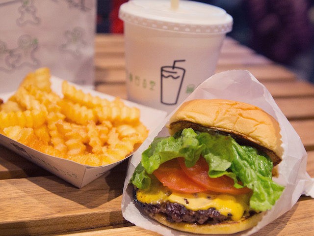 CHICAGO, IL - JANUARY 28: In this photo illustration a cheeseburger and french fries are served up at a Shake Shack restaurant on January 28, 2015 in Chicago, Illinois. The burger chain, with currently has 63 locations, is expected to go public this week with an IPO priced between $17 …