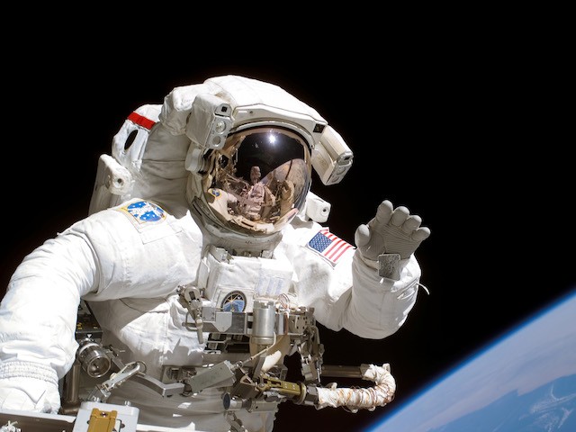 American astronaut Joseph Tanner waves to the camera during a space walk as part of the STS-115 mission to the International Space Station, September 2006. (Photo by NASA/Getty Images)