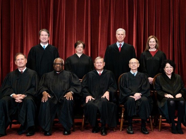 WASHINGTON, DC - APRIL 23: Members of the Supreme Court pose for a group photo at the Supreme Court in Washington, DC on April 23, 2021. Seated from left: Associate Justice Samuel Alito, Associate Justice Clarence Thomas, Chief Justice John Roberts, Associate Justice Stephen Breyer and Associate Justice Sonia Sotomayor, …