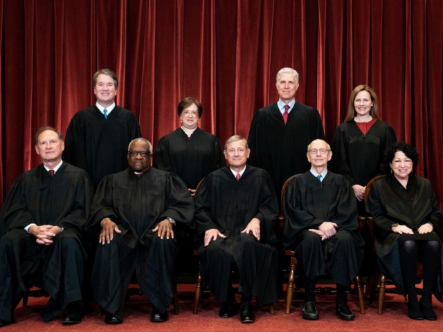 WASHINGTON, DC - APRIL 23: Members of the Supreme Court pose for a group photo at the Supreme Court in Washington, DC on April 23, 2021. Seated from left: Associate Justice Samuel Alito, Associate Justice Clarence Thomas, Chief Justice John Roberts, Associate Justice Stephen Breyer and Associate Justice Sonia Sotomayor, Standing from left: Associate Justice Brett Kavanaugh, Associate Justice Elena Kagan, Associate Justice Neil Gorsuch and Associate Justice Amy Coney Barrett. (Photo by Erin Schaff-Pool/Getty Images)