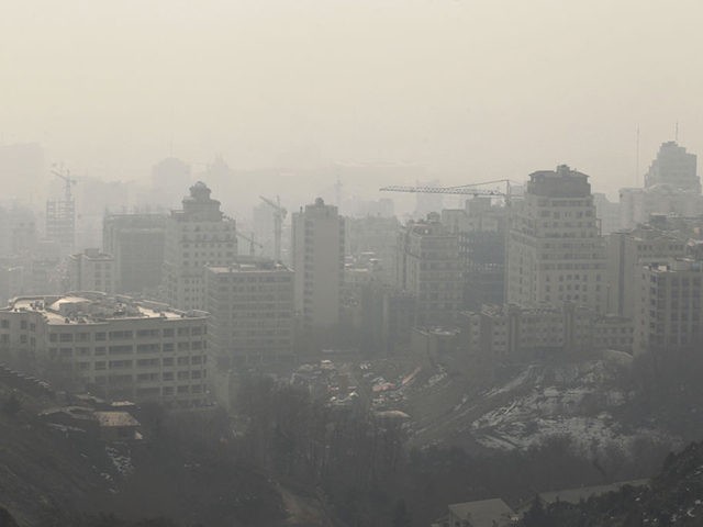A picture taken on January 7, 2013 shows the polluted skyline of the Iranian capital Tehran. Air pollution in Tehran has left 4,460 people dead in a year, an Iranian health official said in reports Sunday, with another sounding the alarm over high dose of carcinogens in domestically-made petrol. AFP …