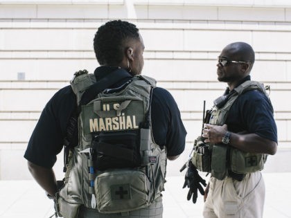 U.S. Marshals provide extra security outside the E. Barrett Prettyman United States Courthouse in Washington D.C. on Saturday, June 28, 2014. Ahmed Abu Khattala, a Libyan thought to be responsible for the 2012 terrorist attacks in Benghazi is being held in federal law enforcement custody. (Photo by Greg Kahn/Getty Images)