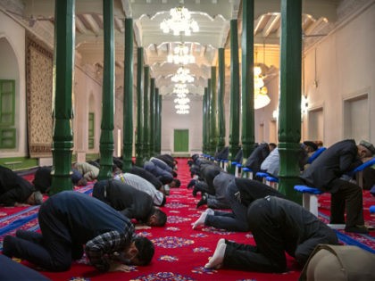 Uyghurs and other members of the faithful pray at the Id Kah Mosque in Kashgar in western China's Xinjiang Uyghur Autonomous Region, as seen during a government organized trip for foreign journalists, Monday, April 19, 2021. A human rights group is appealing to the United Nations to investigate allegations China's …