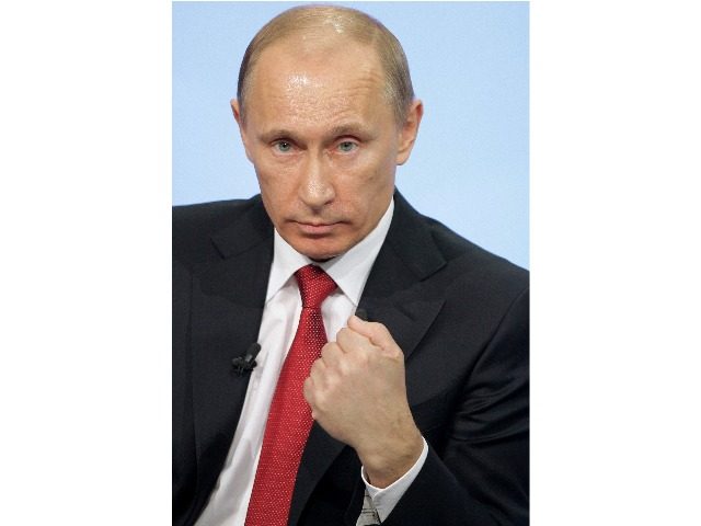 Russian Prime Minister Vladimir Putin gestures as he speaks during his annual question and answer TV marathon session with Russian citizens in Moscow on December 16, 2010. Putin on December 16 issued a chilling message to jailed tycoon Mikhail Khodorkovsky as he held a presidential-style question and answer session with …
