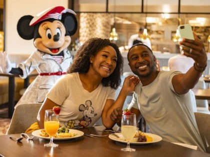 Guests at Disney’s Riviera Resort at Walt Disney World Resort in Lake Buena Vista, Fla., can see Mickey Mouse, Minnie Mouse, Donald Duck and Daisy Duck during breakfast at Topolino’s Terrace – Flavors of the Riviera, the resort’s rooftop restaurant. During the resort’s phased reopening, characters maintain proper physical distancing …