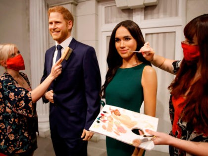Artists put the finishing touches to wax figures of Britain's Prince Harry, Duke of Sussex and Britain's Meghan, Duchess of Sussex as Madame Tussauds prepares to reopen its doors to the public on July 30, 2020 following the easing of coronavirus lockdown restrictions in England. (Photo by Tolga AKMEN / …