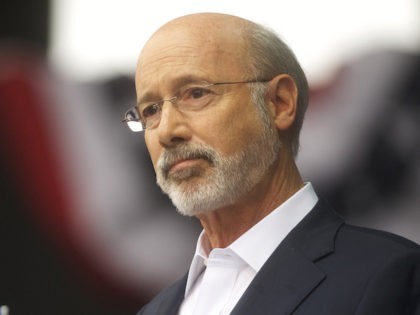 Pennsylvania Governor Tom Wolf speaks before former President Barack Obama during a campai