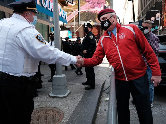 NEW YORK, NEW YORK - APRIL 20: Curtis Sliwa, the founder and chief executive officer of the Guardian Angels, joins other members of the group as they congregate in Times Square near a police precinct as security throughout the city is increased ahead of a verdict in the Derek Chauvin …