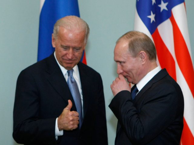 Vice President of the United States Joe Biden, left, geatures as he meets Russian Prime Mi