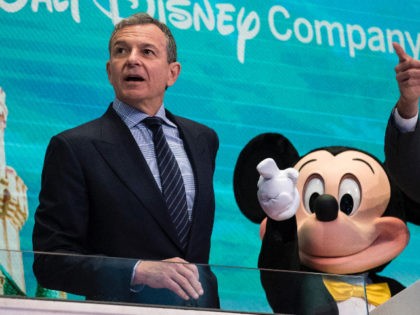 NEW YORK, NY - NOVEMBER 27: (L to R) Chief executive officer and chairman of The Walt Disney Company Bob Iger and Mickey Mouse look on before ringing the opening bell at the New York Stock Exchange (NYSE), November 27, 2017 in New York City. Disney is marking the company's …