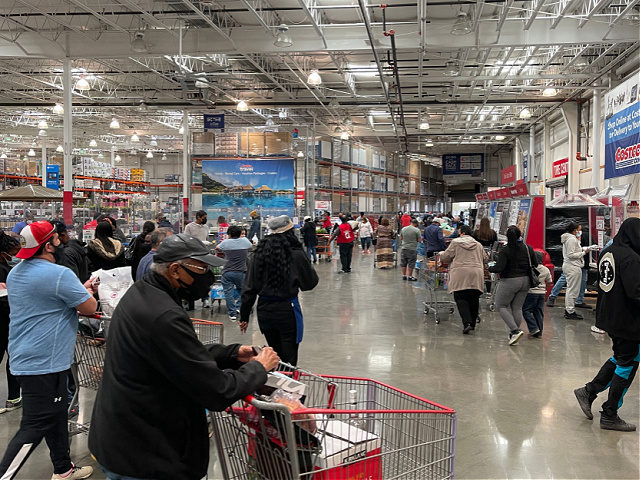 People shop at a Costco store on March 14, 2021 in Washington,DC. (Photo by Daniel SLIM /