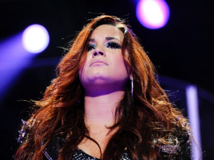 Singer Demi Lovato performs at Z100's Jingle Ball concert at Madison Square Garden on Friday, Dec. 9, 2011 in New York. (AP Photo/Evan Agostini)
