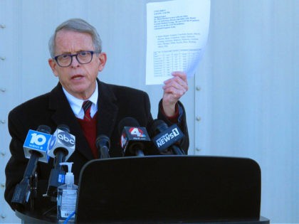 FILE - In this Nov. 18, 2020 file photo, Republican Ohio Gov. Mike DeWine discusses the most recent data on Ohio's soaring coronavirus cases during a news briefing at John Glenn International Airport in Columbus, Ohio. DeWine is ready to address Ohioans in his fourth primetime speech about the state's …