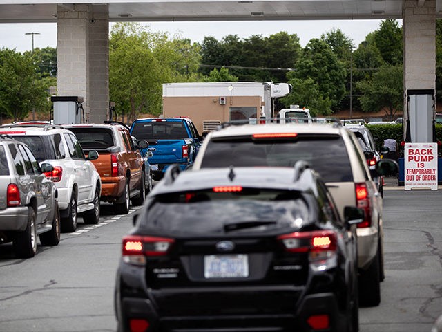 Cars line up to fill their gas tanks at a COSTCO at Tyvola Road in Charlotte, North Carolina on May 11, 2021. - Fears the shutdown of a major fuel pipeline would cause a gasoline shortage led to some panic buying and prompted US regulators on May 11, 2021 to …