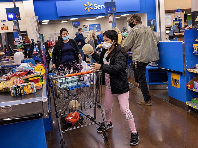 CLARKSVILLE, INDIANA - APRIL 24: Honduran immigrant Nani, 10, helps shop at Walmart a day after the girl arrived to live with her extended family on April 24, 2021 near Clarksville, Indiana. The unaccompanied minor had been released from U.S. Health and Human Services (HHS) custody after spending nearly eight …